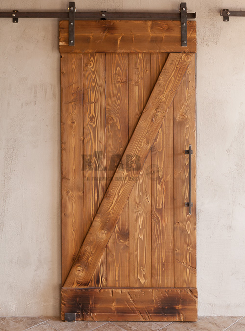 Porta scorrevole da interno in legno massello effetto rustico