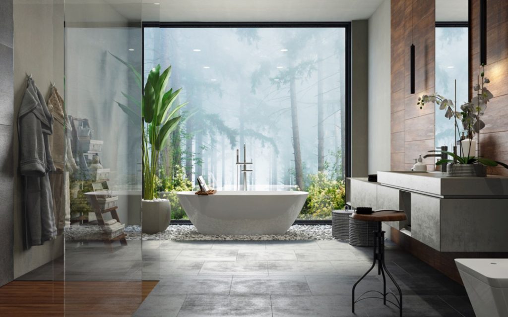 Un bagno patronale con mobile bagno sospeso, vasca e box doccia in vetro